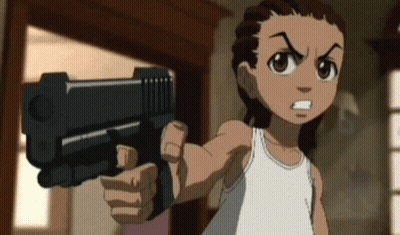 A Boy In A White Tank Top Is Pointing A Gun At The Camera GIF