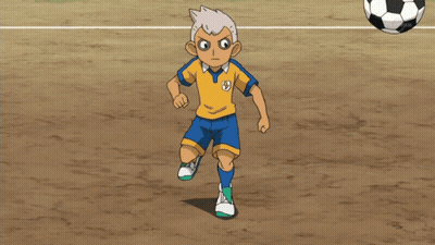 A Boy In A Yellow And Blue Shirt With The Letter S On It GIF