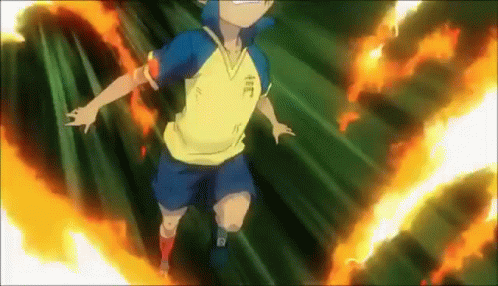 A Boy In A Yellow Shirt And Blue Shorts Is Flying Through The Air Surrounded By Flames . GIF