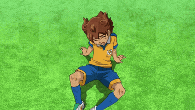 A Boy In A Yellow Shirt And Blue Shorts Is Laying On The Grass With His Hands Reaching Out Towards Him GIF