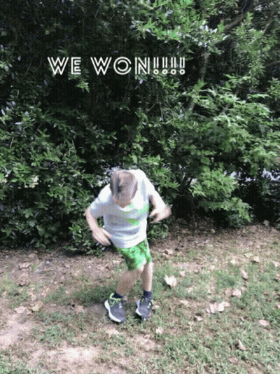 A Boy In Green Shorts Is Jumping In The Air With The Words We Won Written Above Him GIF