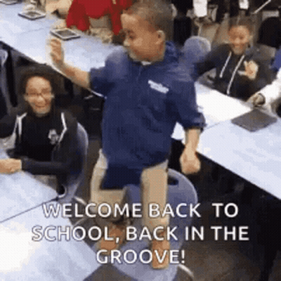 A Boy Is Dancing In A Classroom With A Message That Says `` Welcome Back To School , Back In The Groove '' . GIF