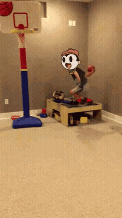 A Boy Is Jumping In The Air With A Basketball In His Hand . GIF
