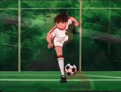 A Boy Is Kicking A Soccer Ball On A Field In A Cartoon . GIF