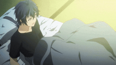A Boy Is Laying On A Bed With A Blanket GIF
