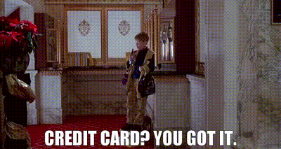 A Boy Is Standing In A Room With The Words `` Credit Card ? You Got It '' Written On The Bottom . GIF