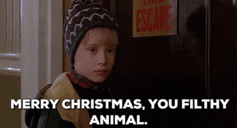A Boy Is Standing In Front Of A Door With A Sign That Says Escape On It . GIF