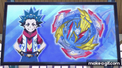 A Boy Is Standing Next To A Blue Spinning Top In Front Of A Large Screen . GIF