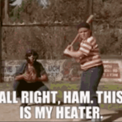 A Boy Is Swinging A Baseball Bat On A Baseball Field While Another Boy Watches . GIF