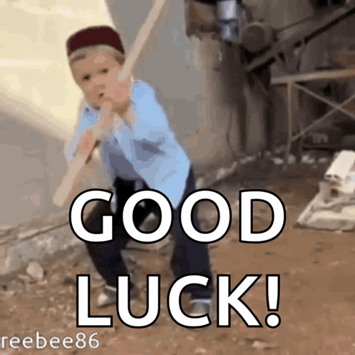 A Boy Is Swinging A Bat With The Words " Good Luck " Behind Him GIF