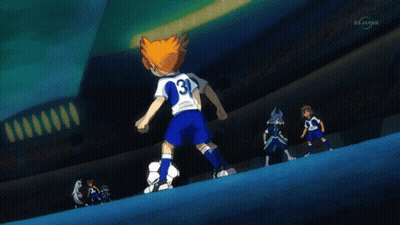 A Boy Kicking A Soccer Ball In Front Of A Stadium That Says Tvtokyo GIF