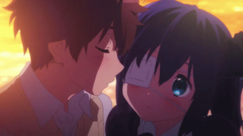 A Boy Kissing A Girl With An Eye Patch GIF