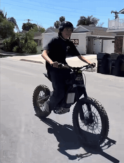 A Boy Riding A Dirt Bike With The Number 427 On The Front GIF