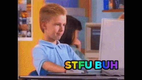 A Boy Sitting In Front Of A Computer With Stfubuh Written On The Screen Behind Him GIF