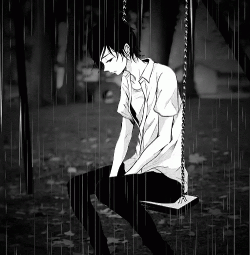 A Boy Sitting On A Swing In The Rain GIF