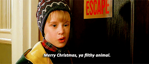 A Boy Standing In Front Of A Sign That Says " Escape " GIF
