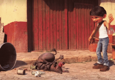 A Boy Standing Next To A Dog That Is Laying On The Ground With Its Mouth Open GIF