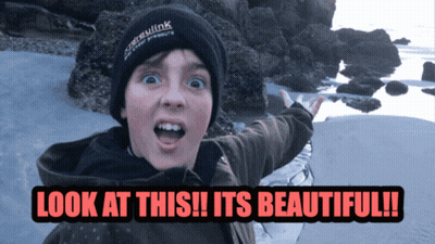 A Boy Wearing A Black Beanie Says Look At This GIF
