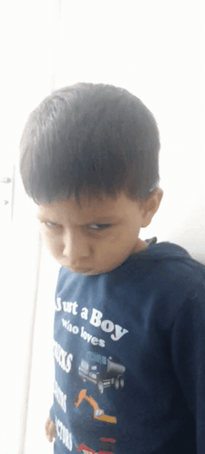 A Boy Wearing A Blue Shirt That Says Just A Boy Who Loves Trucks GIF