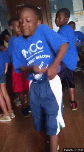 A Boy Wearing A Blue Shirt That Says Mcc GIF