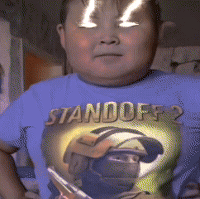 A Boy Wearing A Blue Shirt That Says " Standoff 2 " GIF