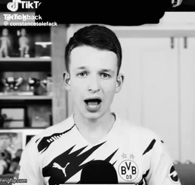 A Boy Wearing A Bvb 09 Jersey Is Making A Funny Face GIF