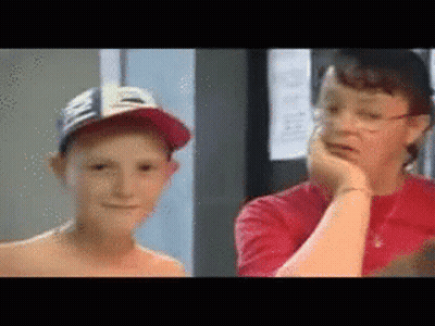 a boy wearing a hat and a woman wearing glasses