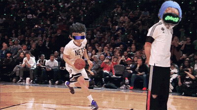 A Boy Wearing A Nets Jersey Dribbles A Basketball On A Court GIF