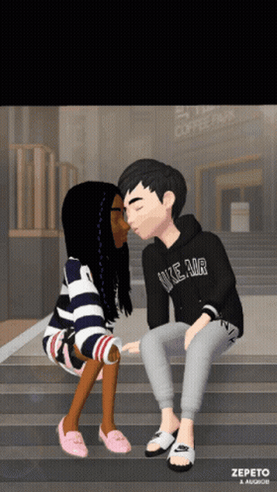 A Boy Wearing A Nike Air Hoodie Kisses A Girl GIF
