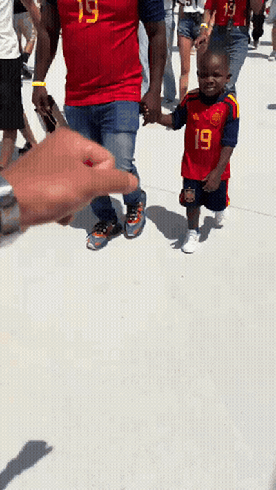 A Boy Wearing A Red Jersey With The Number 19 On It GIF