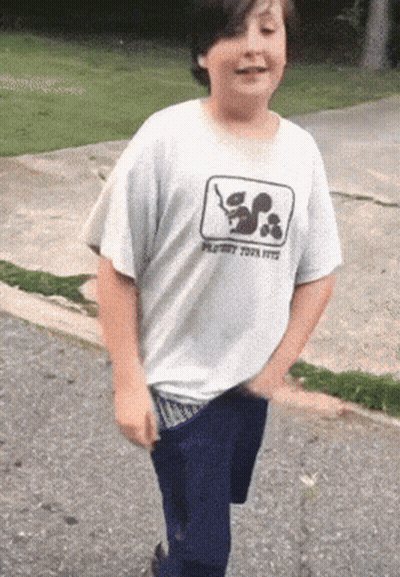 A Boy Wearing A Shirt That Says Playboy Toys GIF