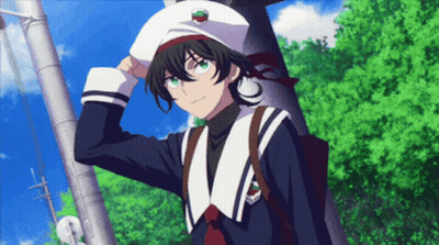 A Boy Wearing A White Hat With A Cherry On It Is Standing Next To A Tree GIF