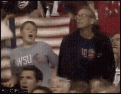 A Boy Wearing A Wsu Shirt Is Screaming In The Stands GIF