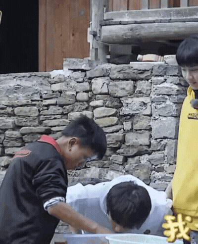 A Boy Wearing A Yellow Sweatshirt That Says ' Supreme ' On It Stands Next To A Boy In A Black Jacket GIF