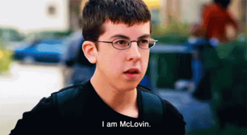 A Boy Wearing Glasses And A Black Shirt Says I Am Mclovin GIF