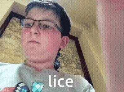 A Boy Wearing Glasses And A Shirt With Lice On It GIF
