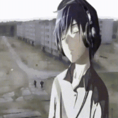 A Boy Wearing Headphones Is Listening To Music GIF