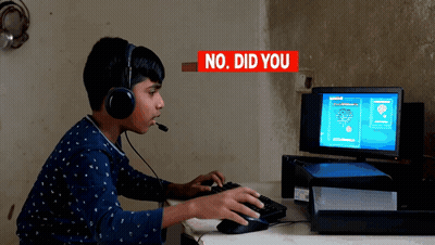 A Boy Wearing Headphones Is Playing A Game On A Computer With The Words " No Did You " Behind Him GIF