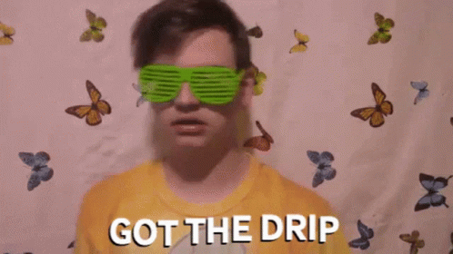 A Boy Wearing Sunglasses And A Yellow Shirt With The Words Got The Drip Written On It GIF