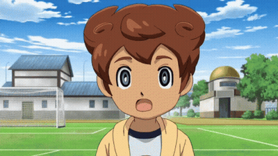 A Boy With A Surprised Look On His Face Stands In Front Of A Soccer Field GIF