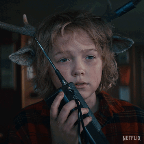 A Boy With Antlers On His Head Is Holding A Walkie Talkie And The Words It 'S Done Are Above Him GIF