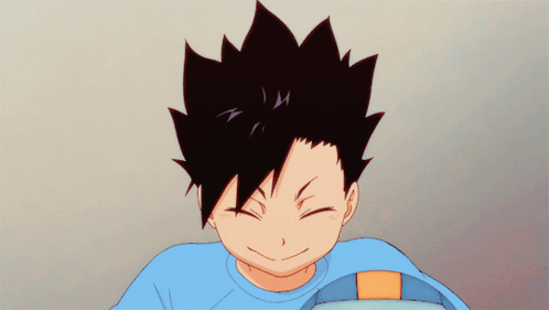 A Boy With Black Hair And A Blue Shirt Is Smiling With His Eyes Closed GIF