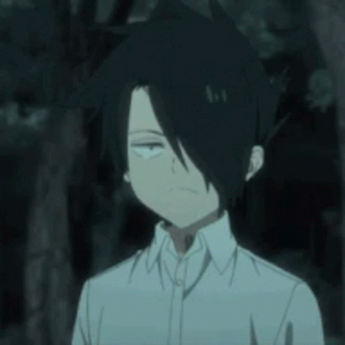 A Boy With Black Hair And A White Shirt Is Making A Funny Face . GIF