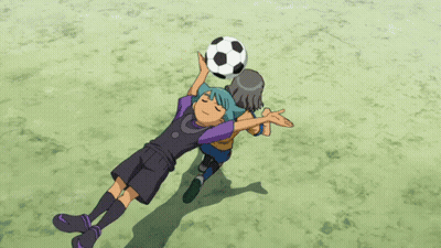 A Boy With Blue Hair Is Holding A Soccer Ball Over His Head GIF