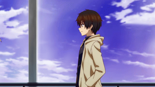 A Boy With His Hands In His Pockets Stands In Front Of A Cloudy Blue Sky GIF