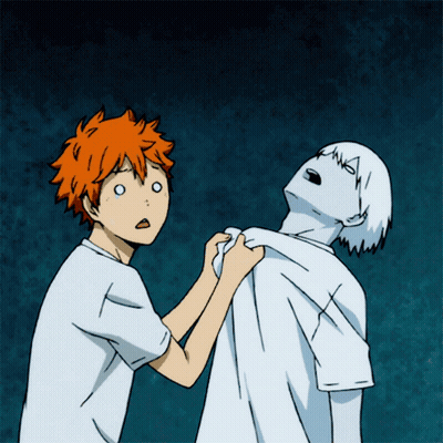 A Boy With Orange Hair Is Holding Another Boy 'S Arm GIF
