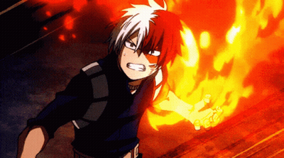 A Boy With Red And White Hair Is Holding A Fireball In His Hand . GIF