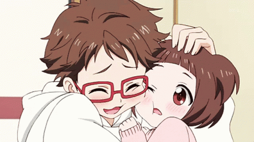 A Boy With Red Glasses Is Hugging A Girl With Brown Hair GIF