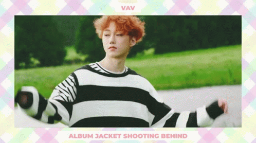 A Boy With Red Hair Is Wearing A Black And White Striped Sweater GIF