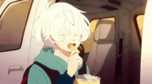 A Boy With White Hair Is Eating A Bag Of Potato Chips In A Car . GIF